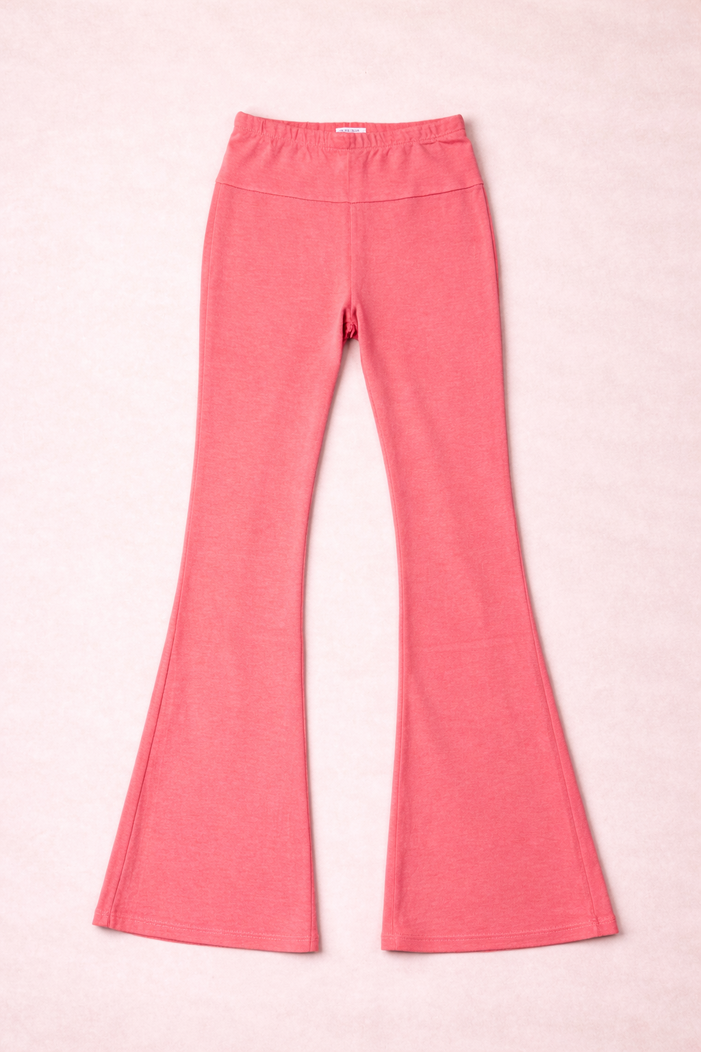 coral leggings on a pink background