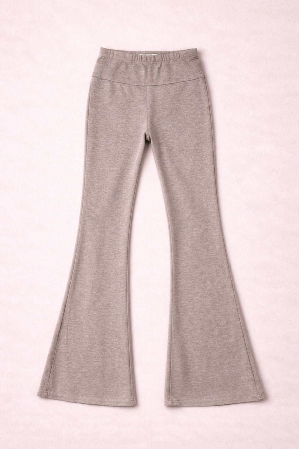 taupe leggings on a pink background